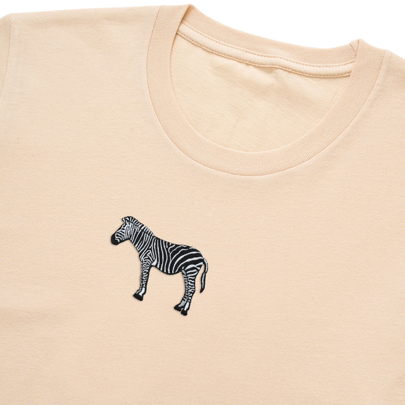 Bobby's Planet Women's Embroidered Zebra T-Shirt from African Animals Collection in Soft Cream Color#color_soft-cream