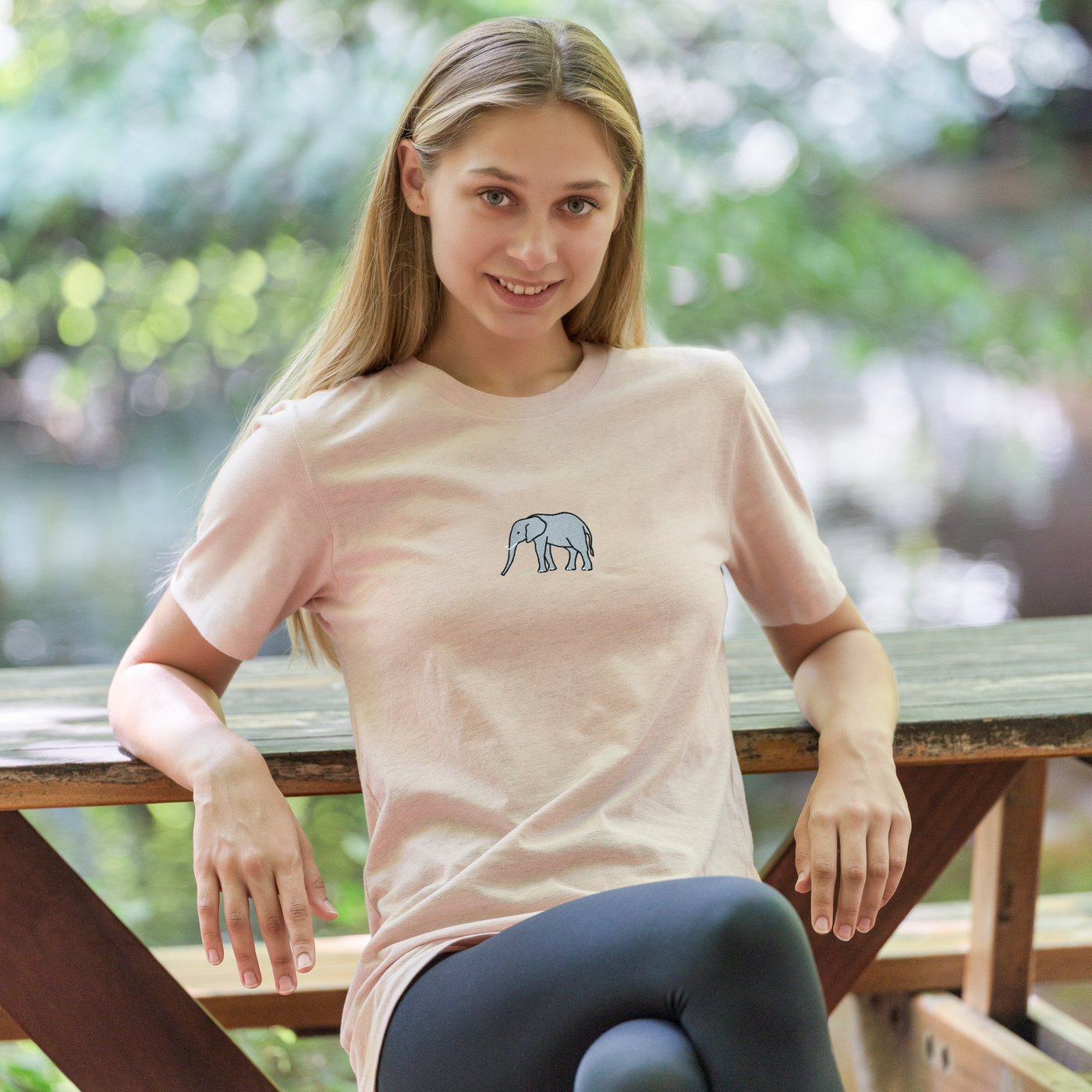 Bobby's Planet Women's Embroidered Elephant T-Shirt from African Animals Collection in Heather Prism Peach Color#color_heather-prism-peach